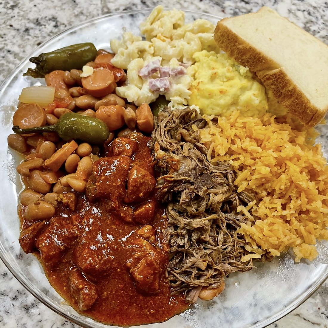 A full plate: beans, rice, chile and shredded beef