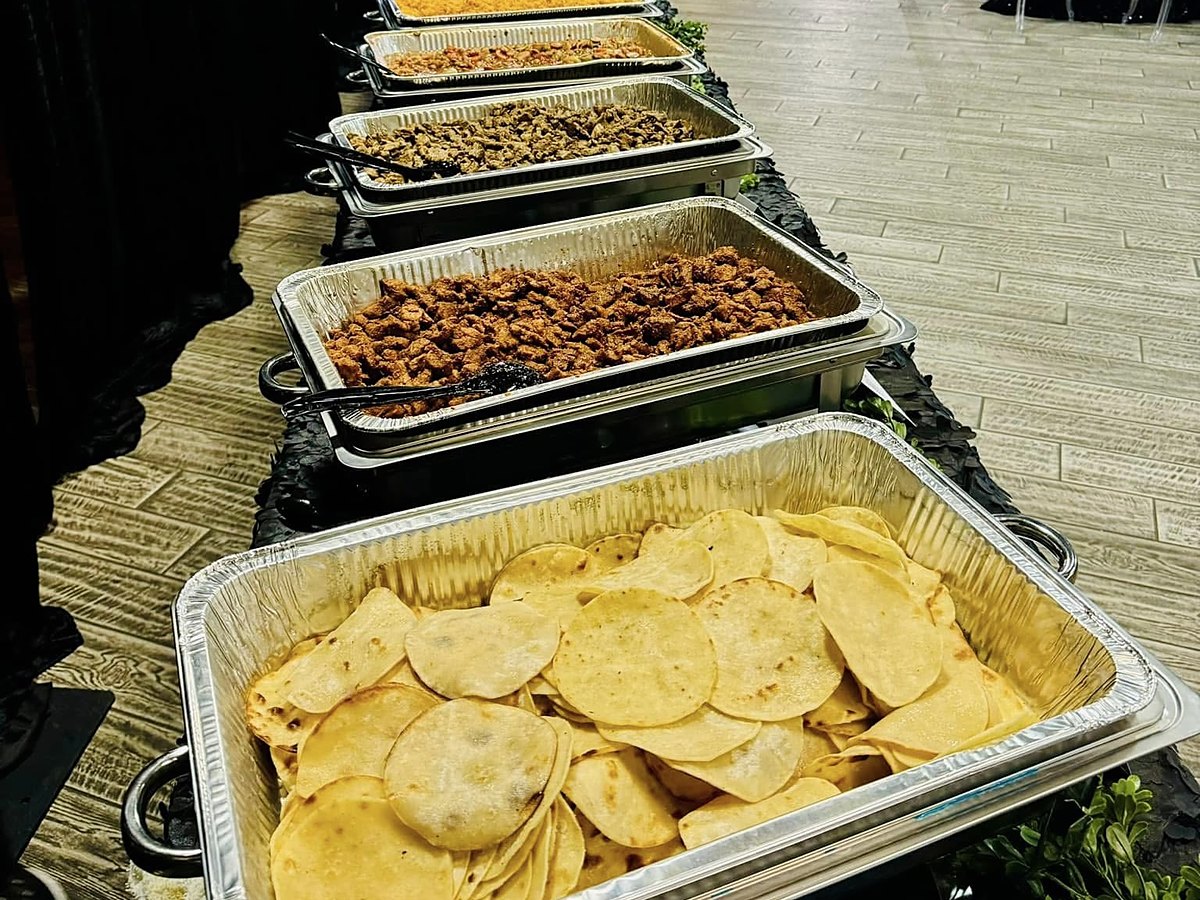 A full buffet line set up at an event venue