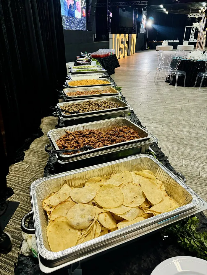 A full buffet line set up at an event venue